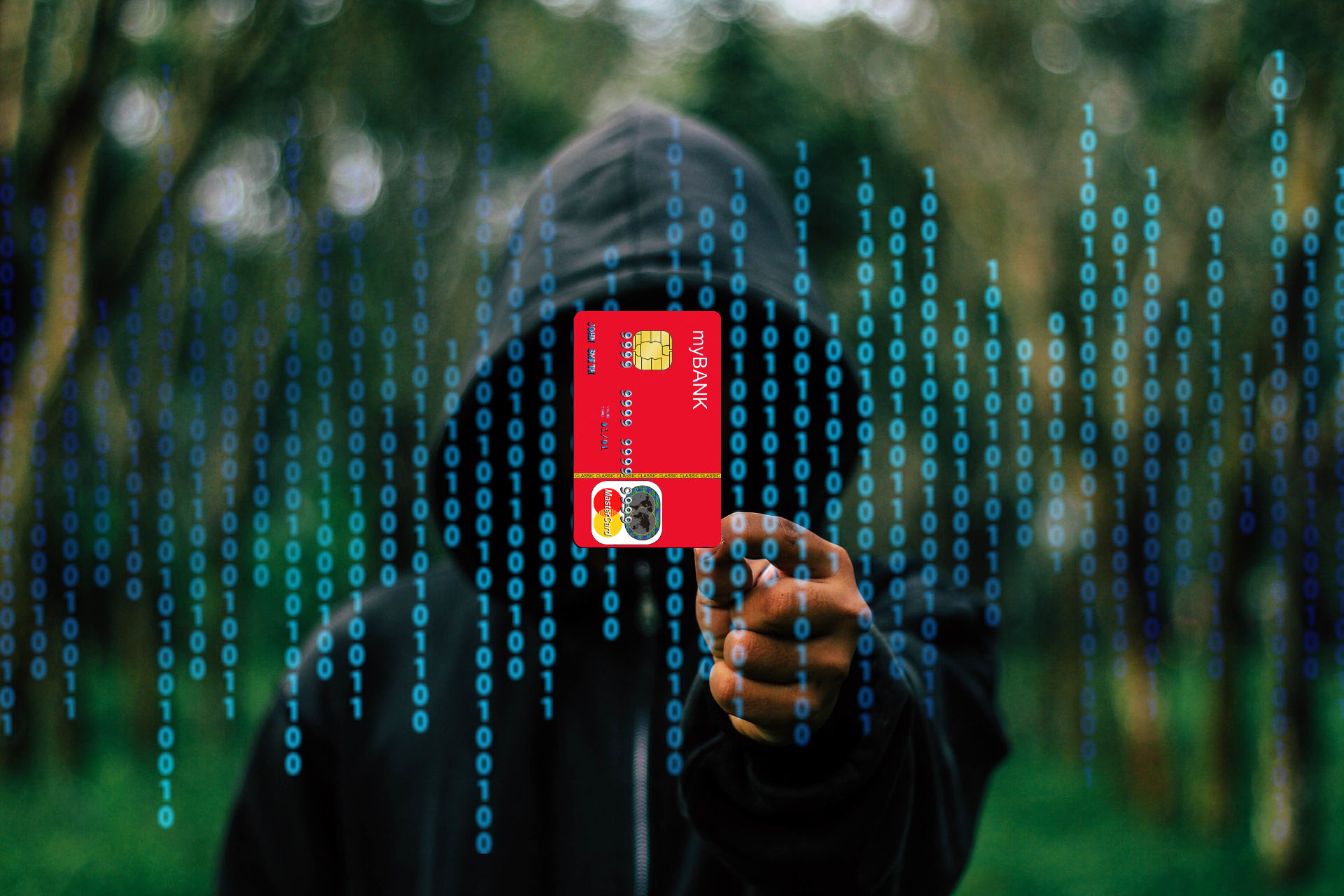 image of hacker displaying stolen credit card